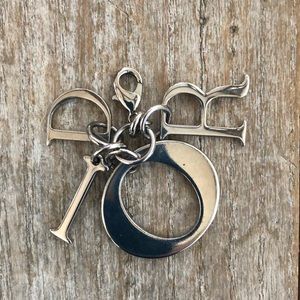 Christian Dior bag charm.  Silvertone hardware lobster claw clasp